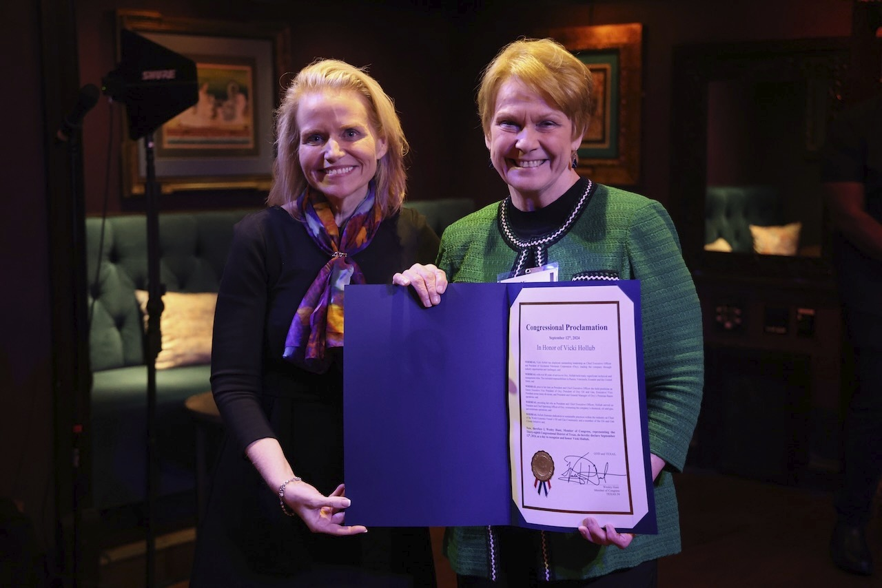 Katie Mehnert presenting Congressional Proclamation to Vicki Hollub